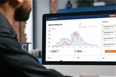 Man logging into the Quantaco platform on his computer