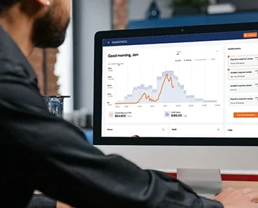 Man logging into the Quantaco platform on his computer